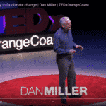 Dan Miller on stage during his TEDx Talk on carbon fee and carbon dividend